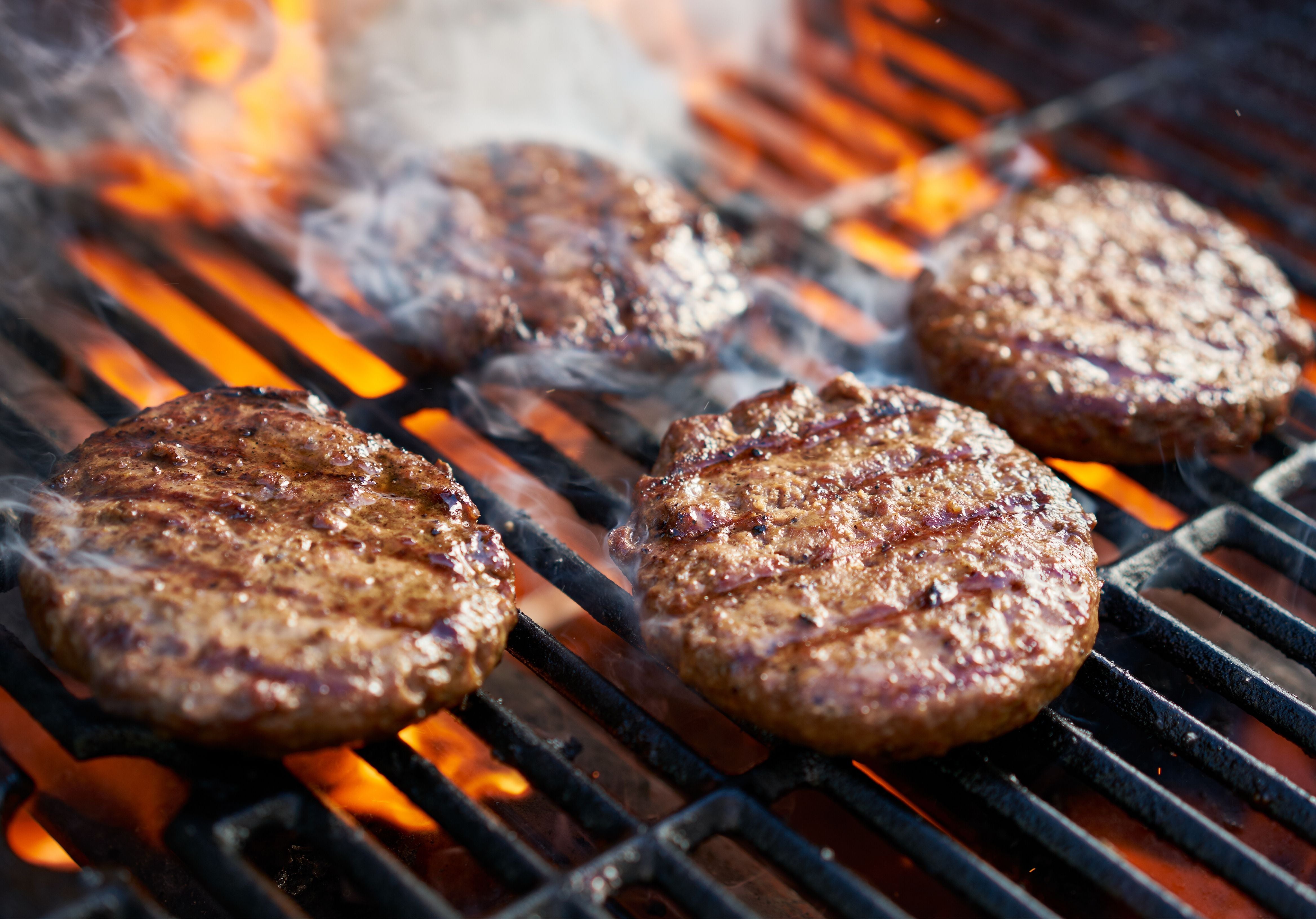 Bison burgers on a grill. King George's.