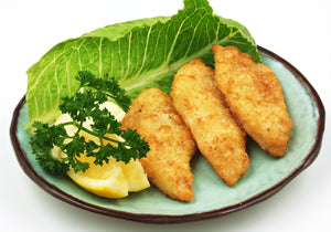 Sole with Lemon baked and displayed with lemon wedges, parsley and lettuce. King George's Steak and Seafood.