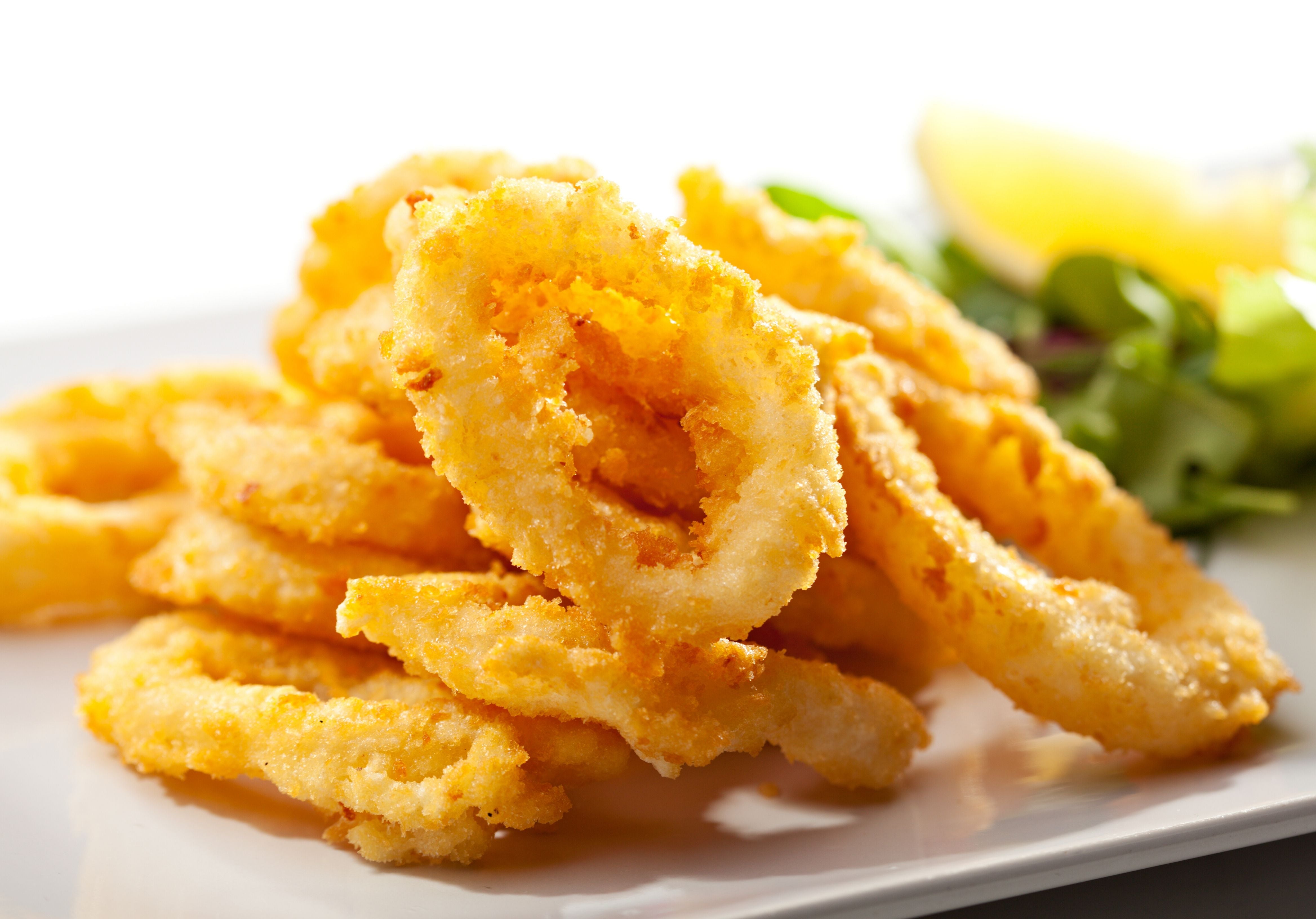 Fried calamari rings served with lemon. King George's Steaks and Seafood.