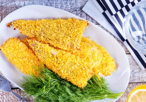 Baked breaded perch garnished with lemon and fresh dill. King George's Steaks and Seafood.